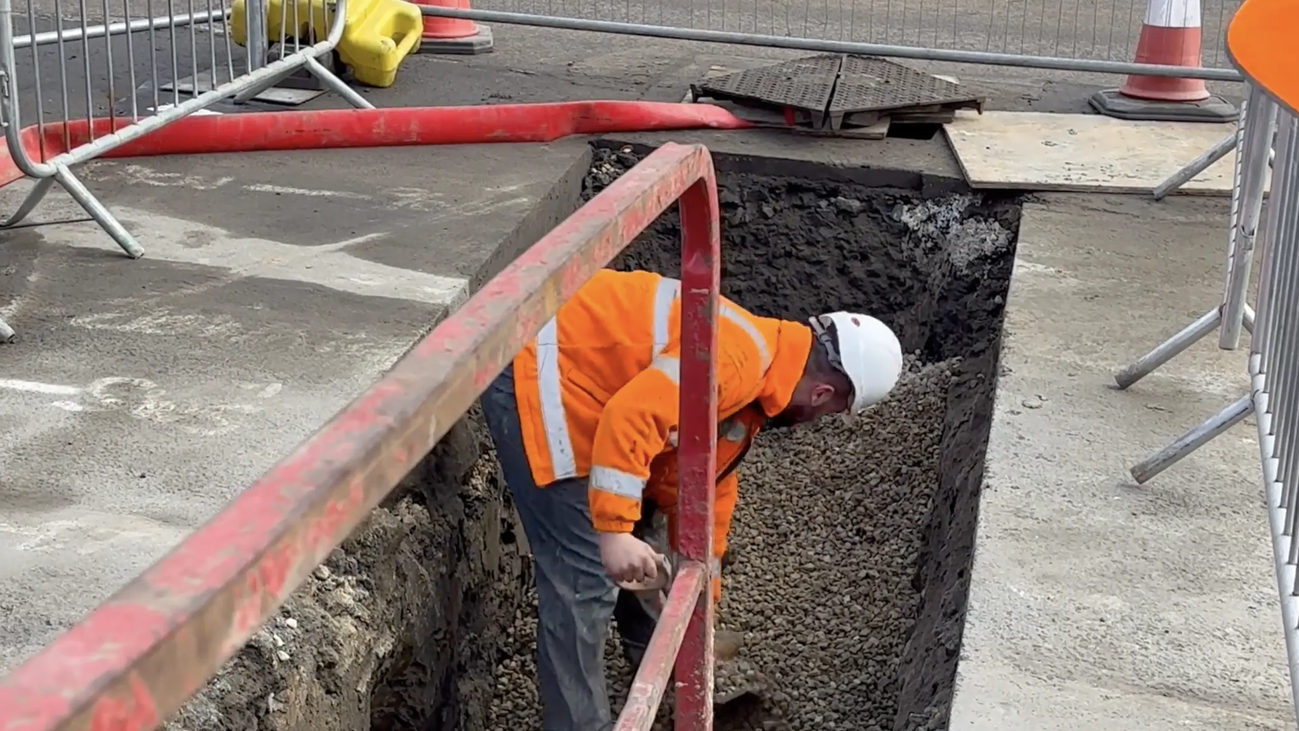 Council worker digging up underground assets